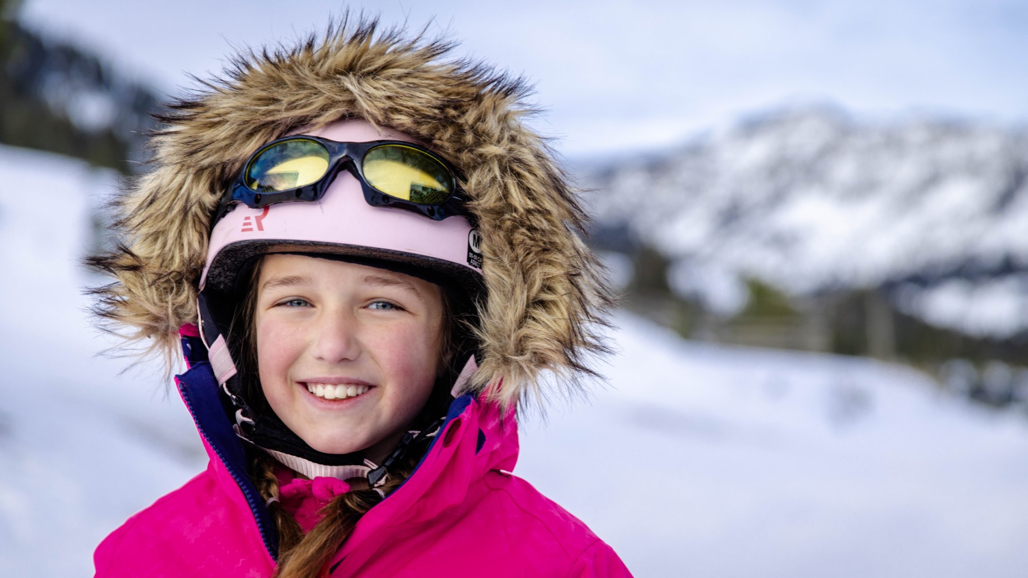 A child smiles near Sleeping Giant Ski Area