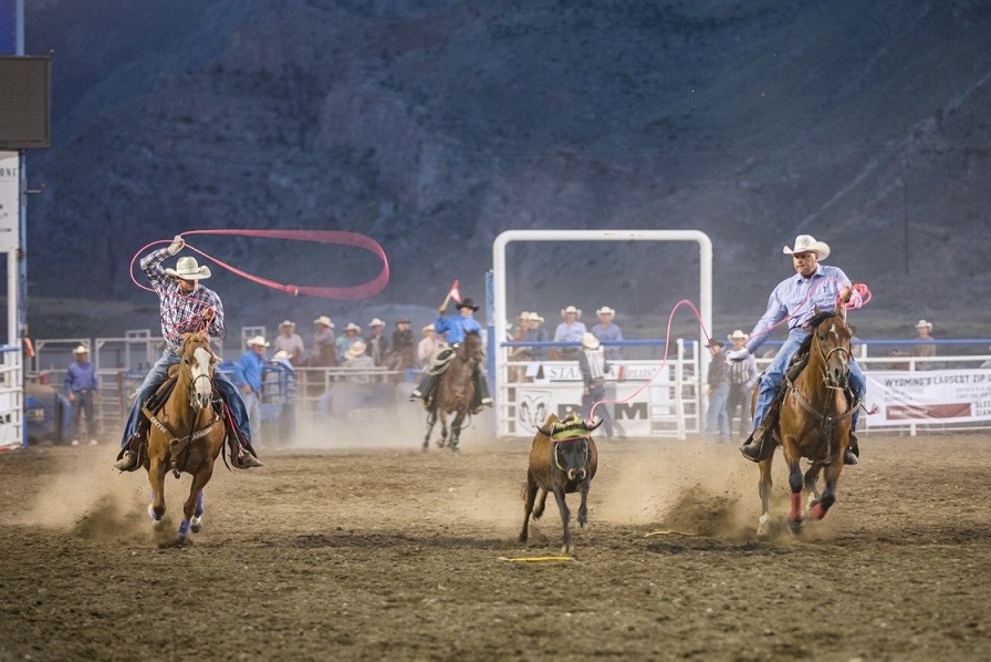 Cowboys performing at the rodeo at Cody