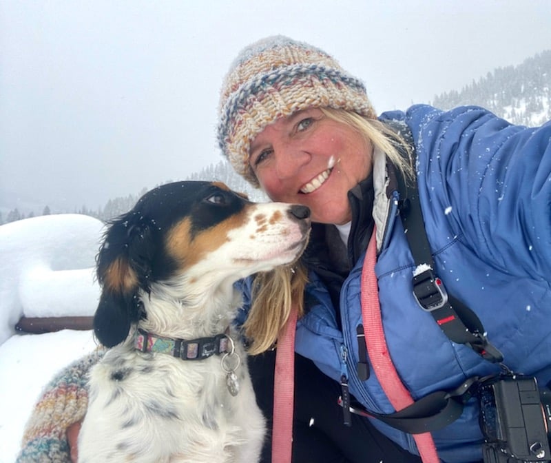 Amy Gerber outside in the snow with her dog