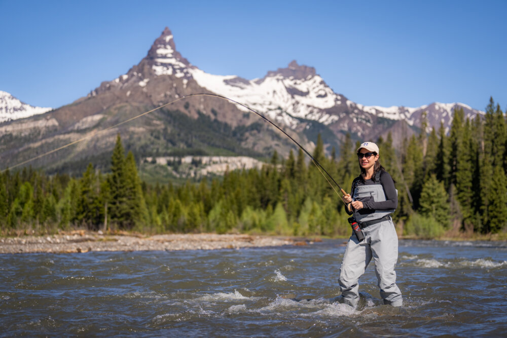 A woman fishes near Cody Yellowstone