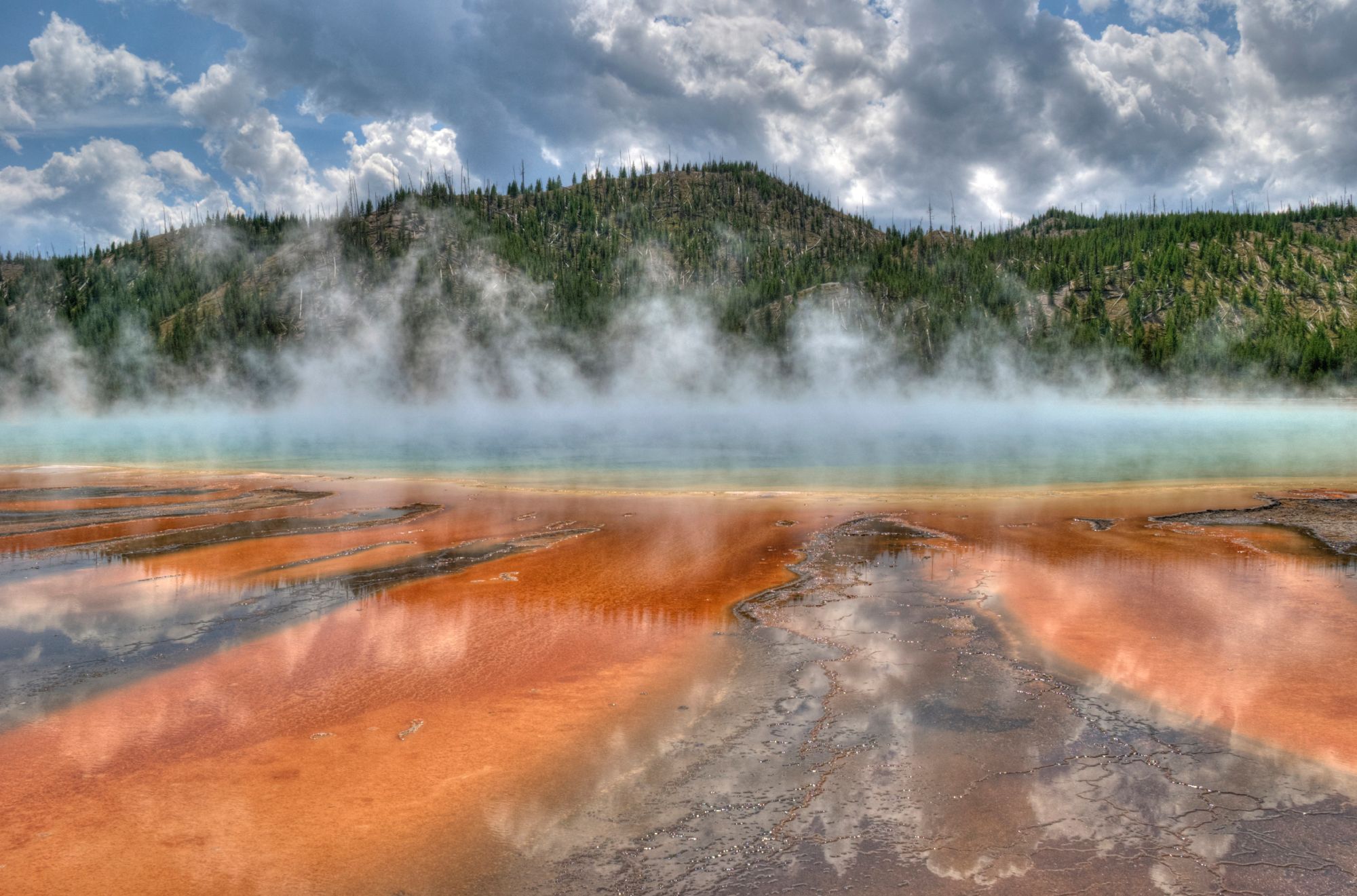 The colorful Grand Prismatic Spring on a cloudy day in Cody Yellowstone
