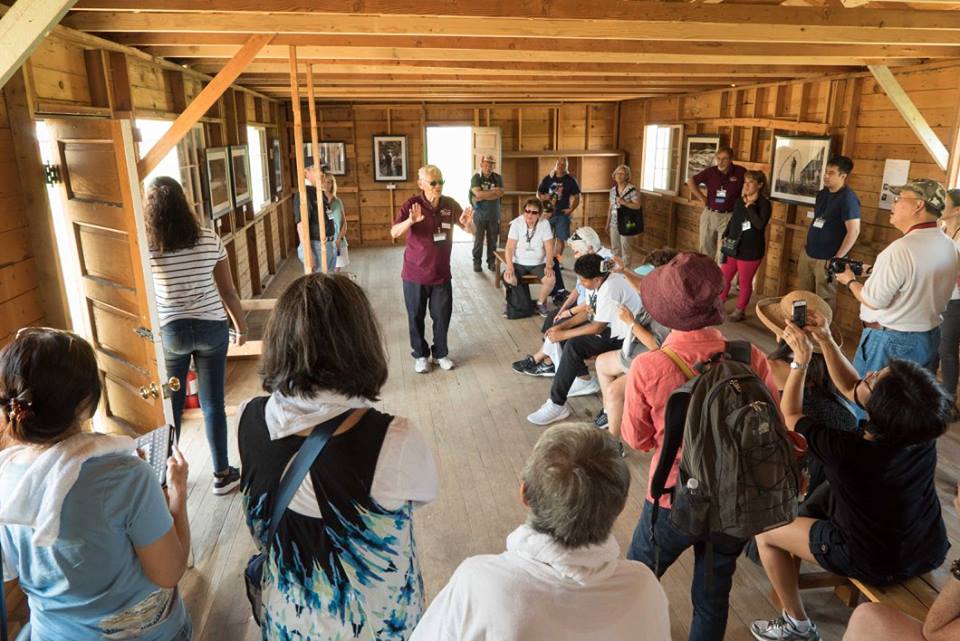 A tour guide shares a story at Heart Mountain Interpretive Center in Cody Yellowstone