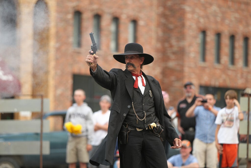 A gunslinger performs outside the Irma Hotel in Cody Yellowstone