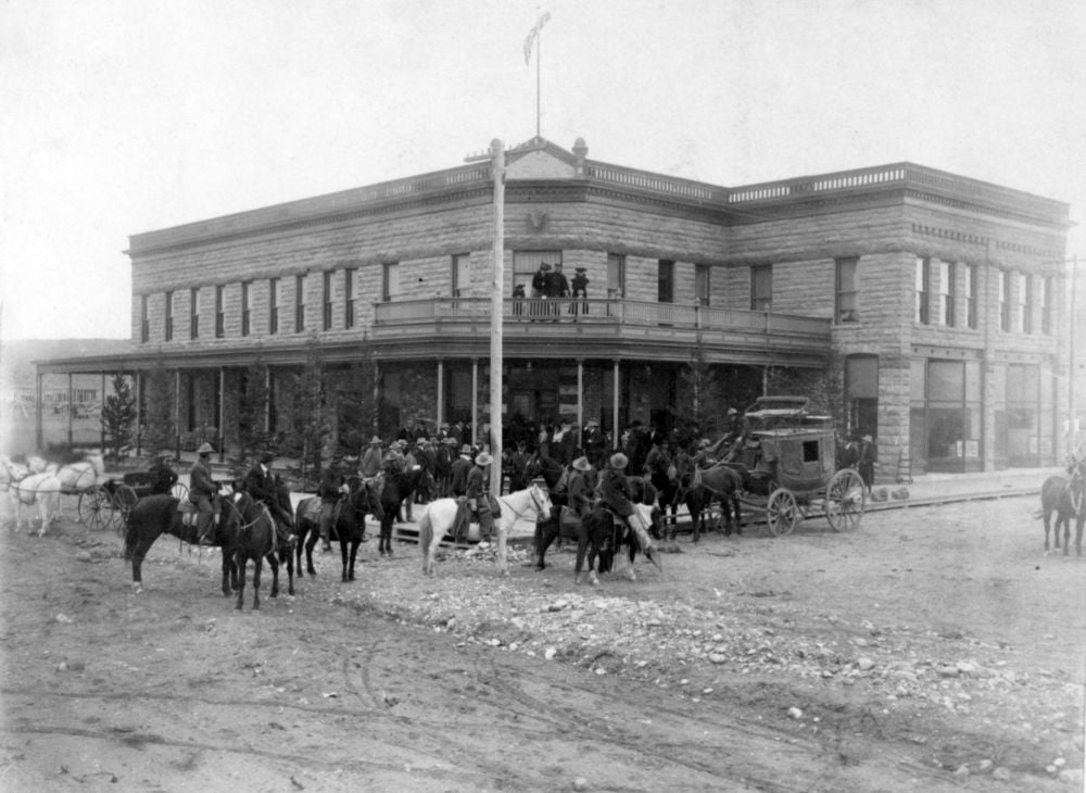 A black and white photo of the Irma Hotel in Cody Yellowstone