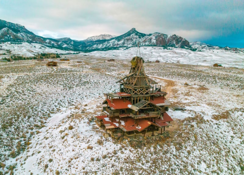 Snow blankets the roof of a building, captured from above, highlighting the serene winter scene