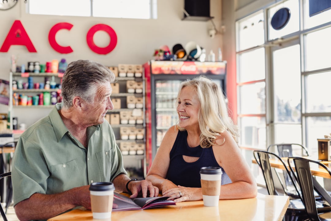 A man and woman planning their Cody Yellowstone vacation