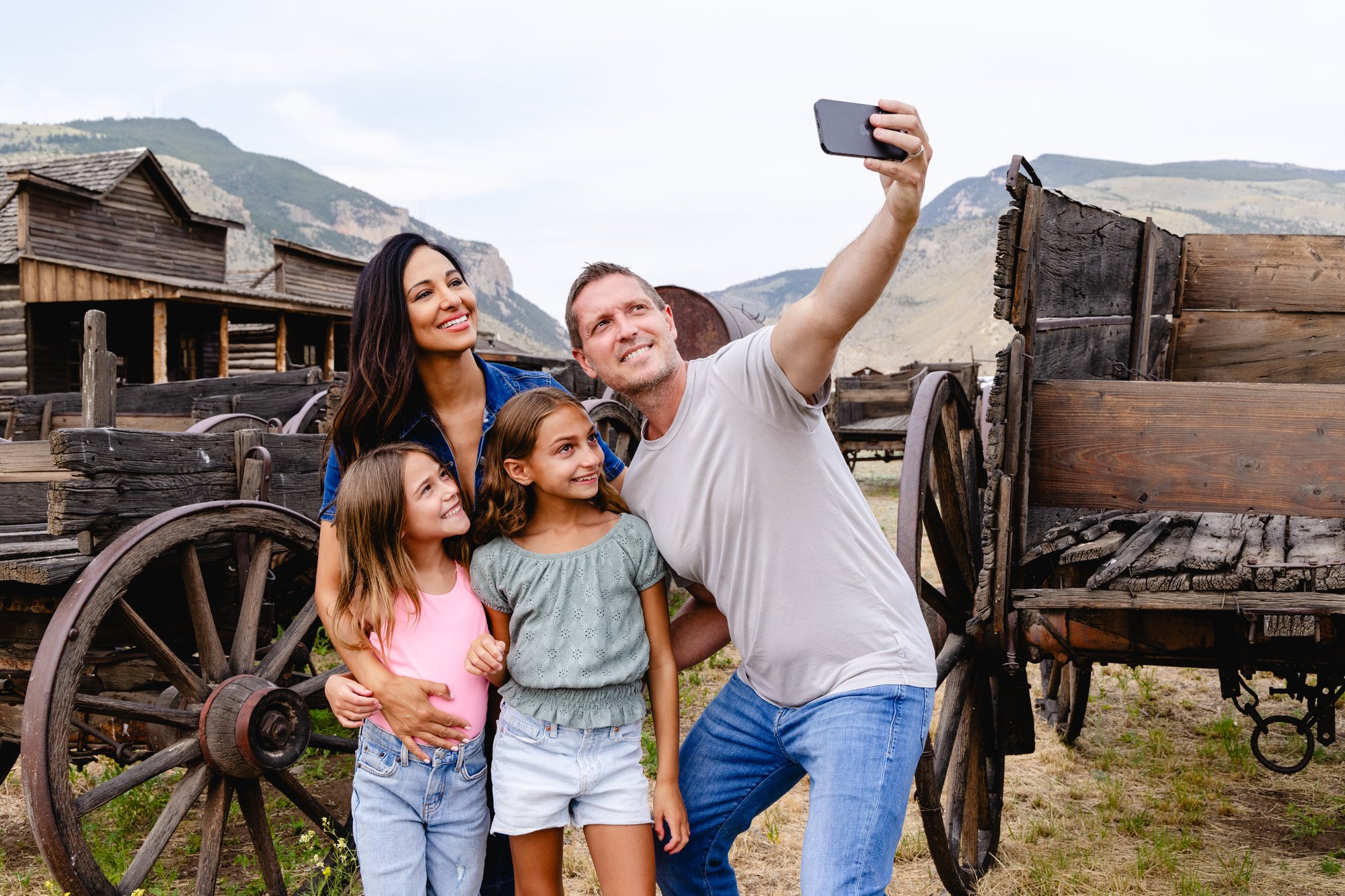A family poses for a photo at Old Trail Town in Cody Yellowstone