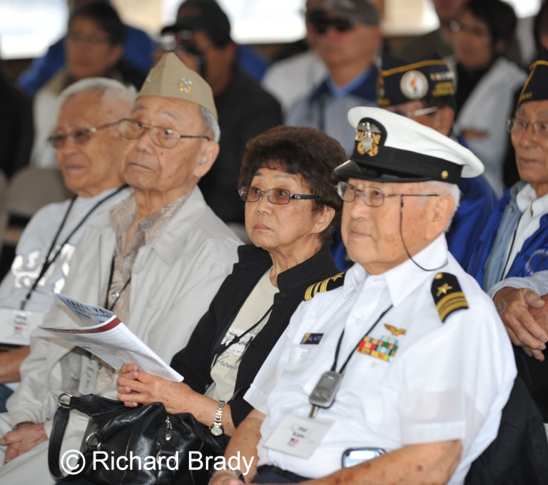 people sitting watching an event