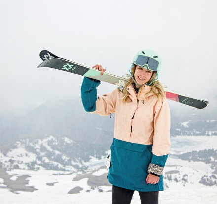 A woman stands with her skies on her shoulder at Sleeping Giant Ski Area in Cody Yellowstone
