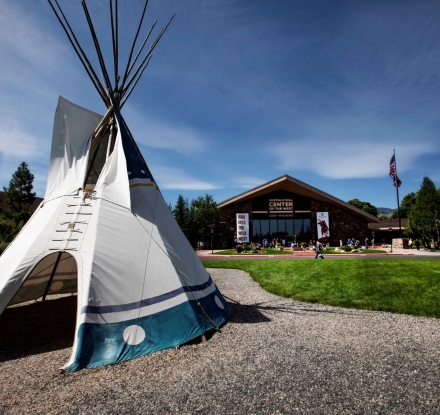 A Teepee in front of the Buffalo Bill center of the West.