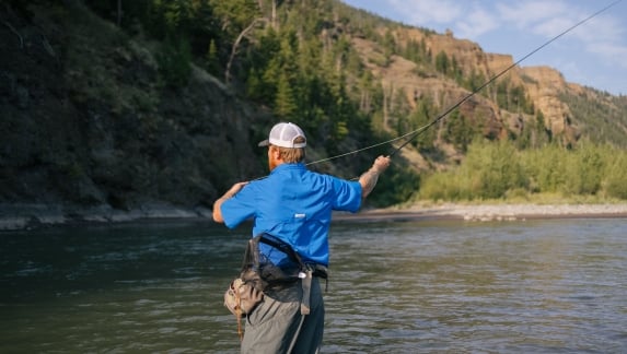 A man goes fishing in Cody Yellowstone